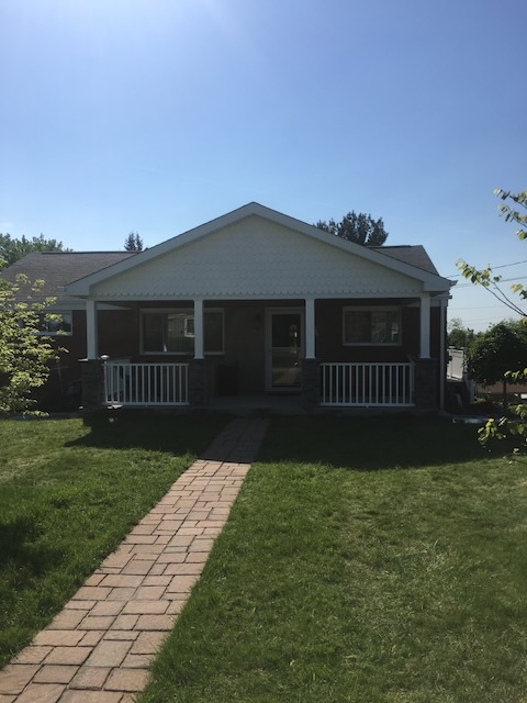 Covered porch with paver walkway