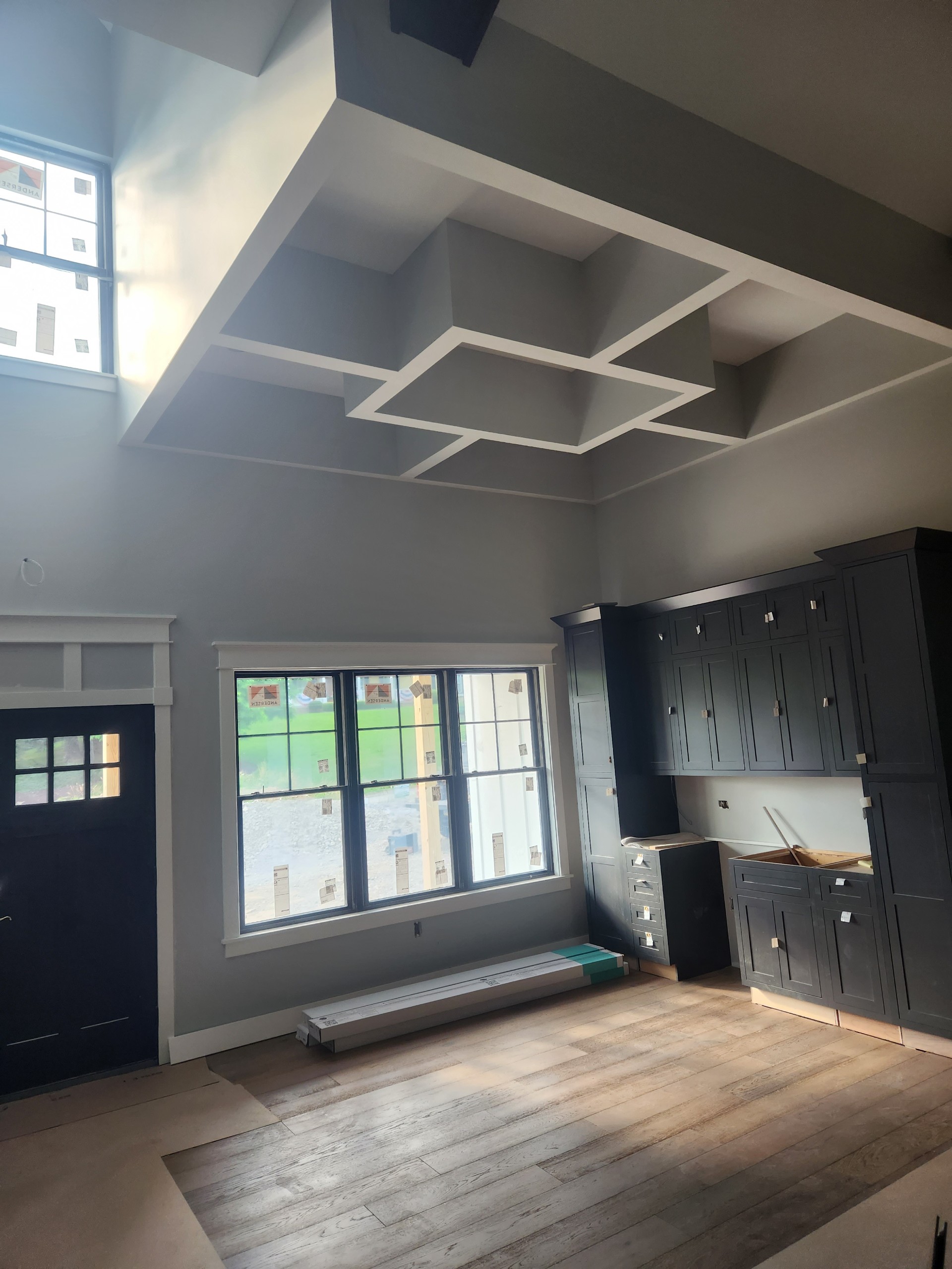 Navy inset cabinets with coffered ceiling