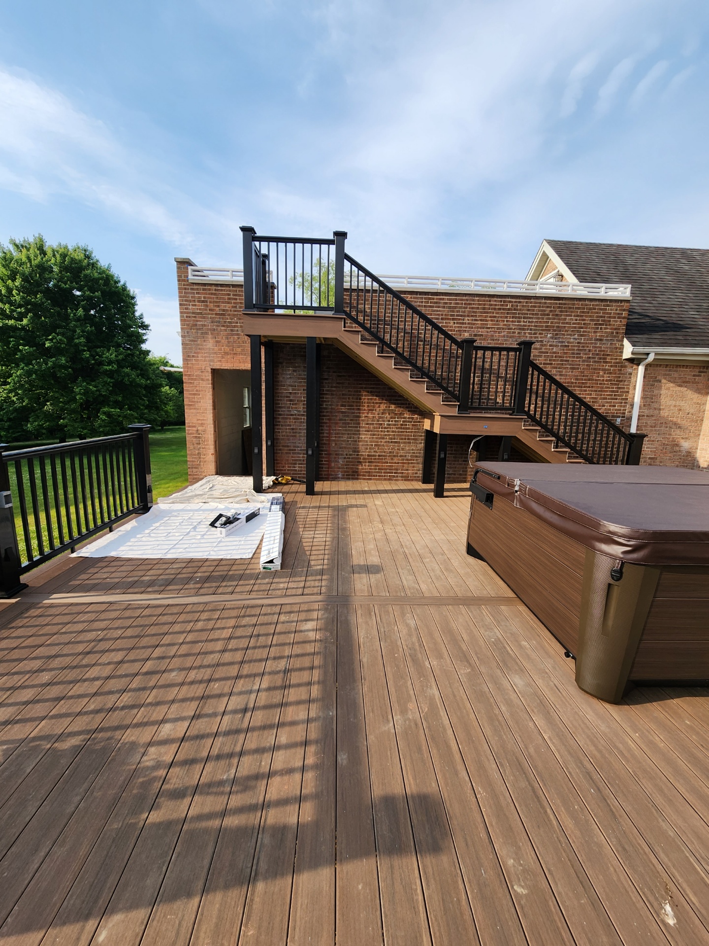 Multi-level composite deck with hot tub patio
