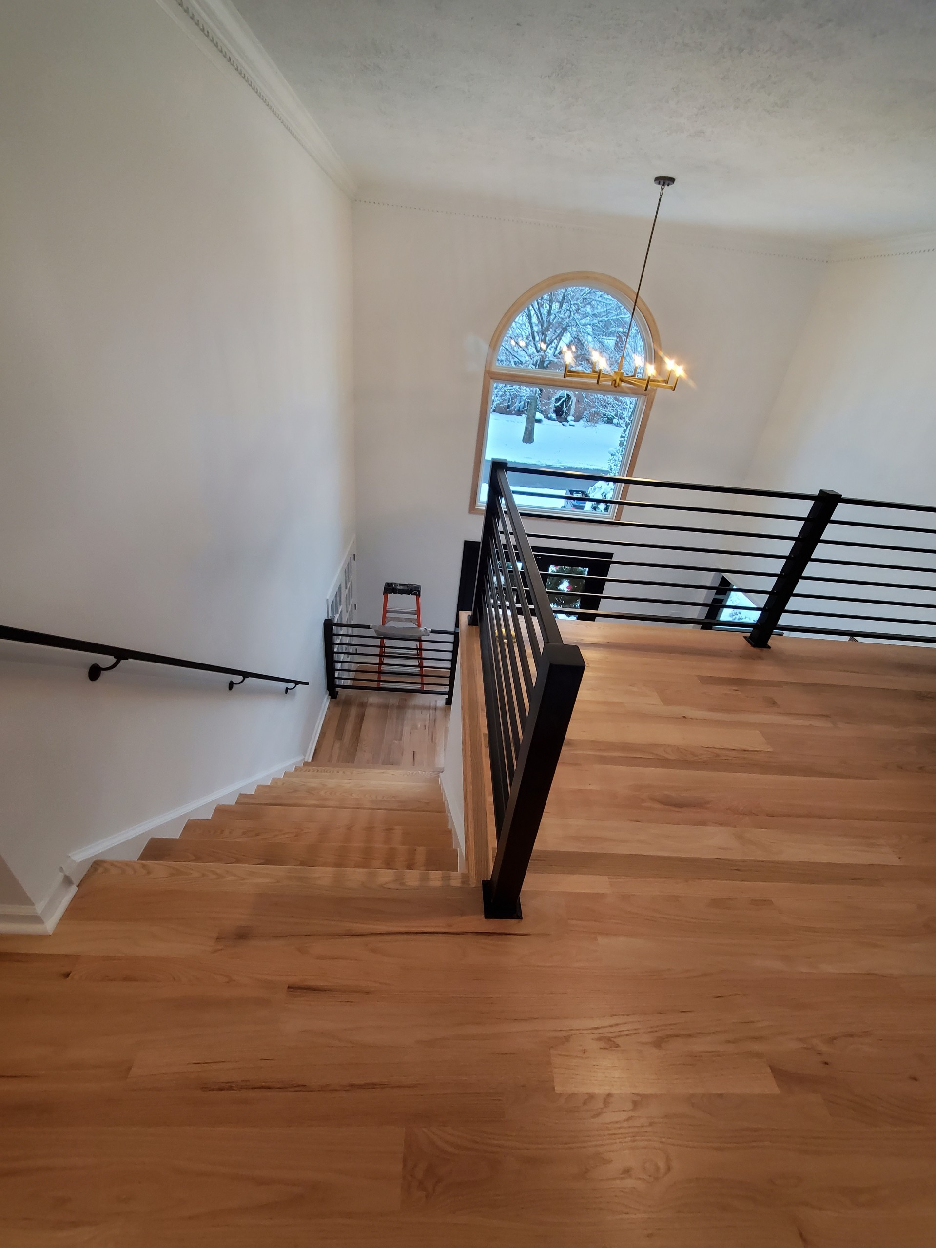 Custom home staircase with black railing