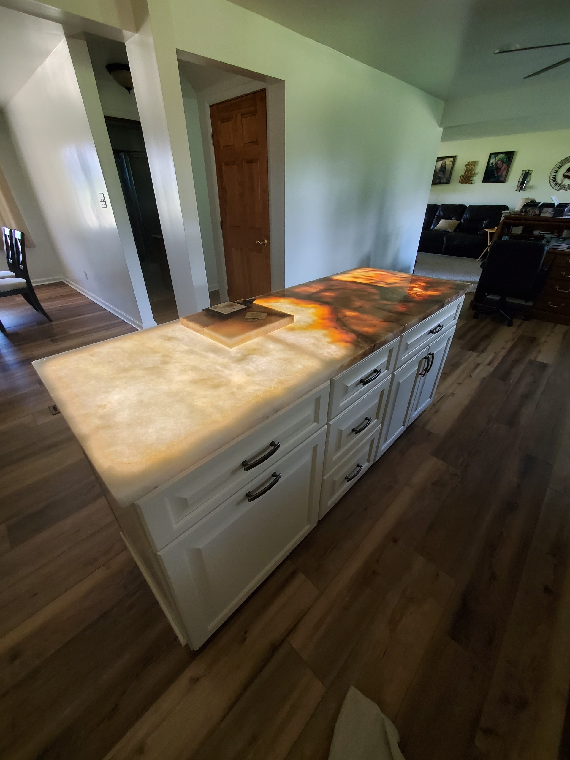 Backlit onyx island countertop in kitchen