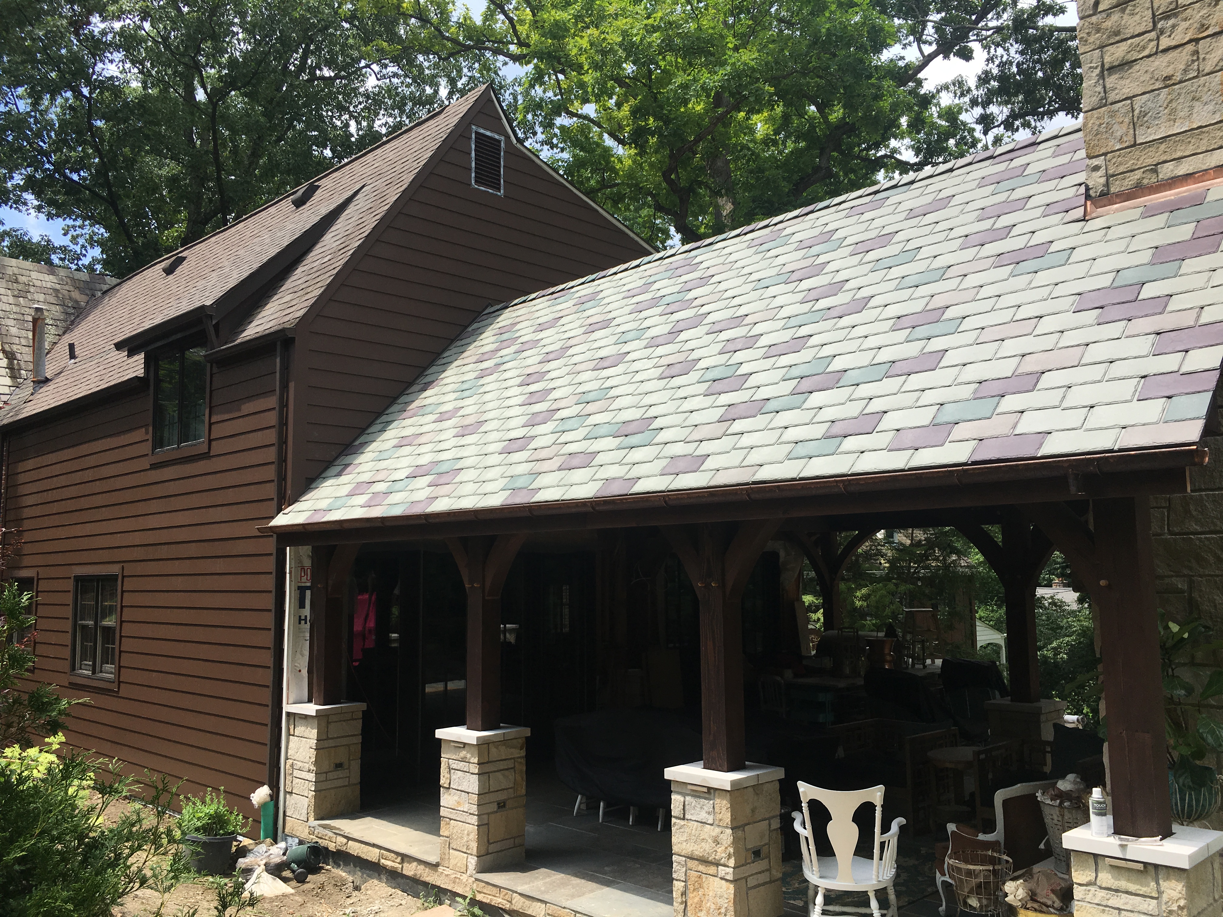 Outdoor pavilion with slate roof and stone columns