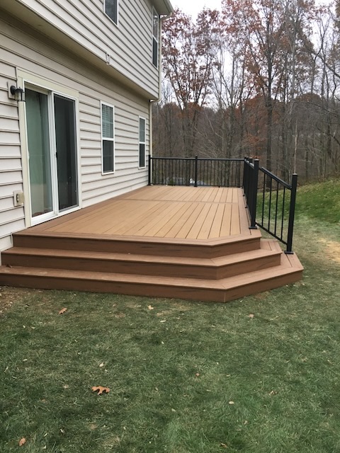 Two-tone composite deck with aluminum railing