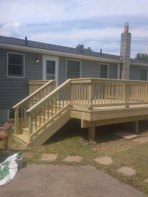 Wood deck with stairs and railing